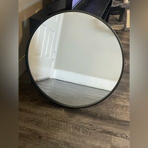Large black round wall mirror